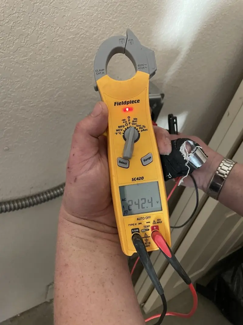 Voltage testing with clamp meter during Ceiling Fan Installation in North Castle